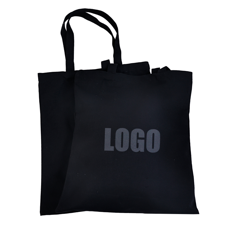 black canvas tote bag with understated gray logo print - view 2
