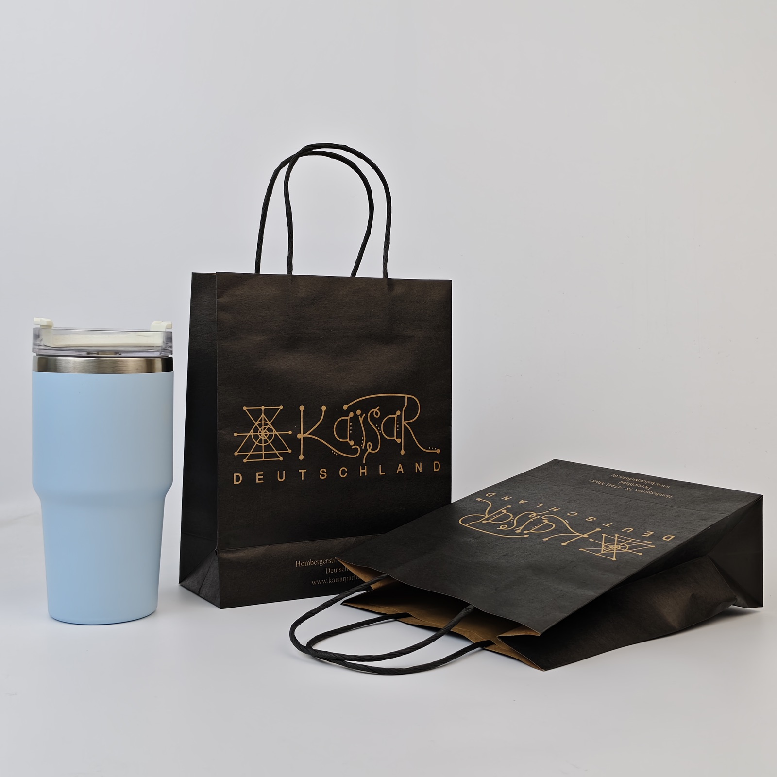 black kraft paper shopping bag with metallic print and twisted handles - view 2