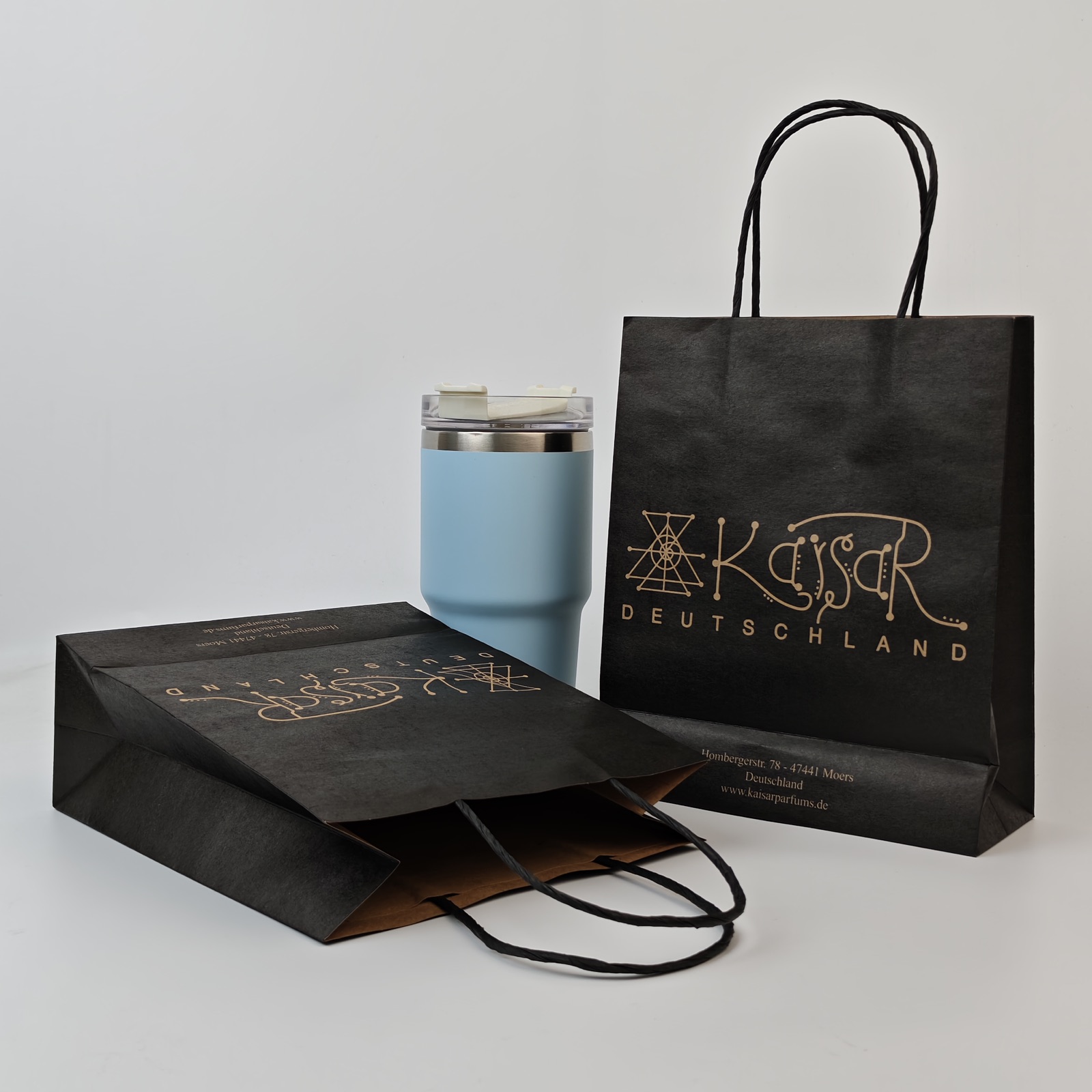black kraft paper shopping bag with metallic print and twisted handles - view 6