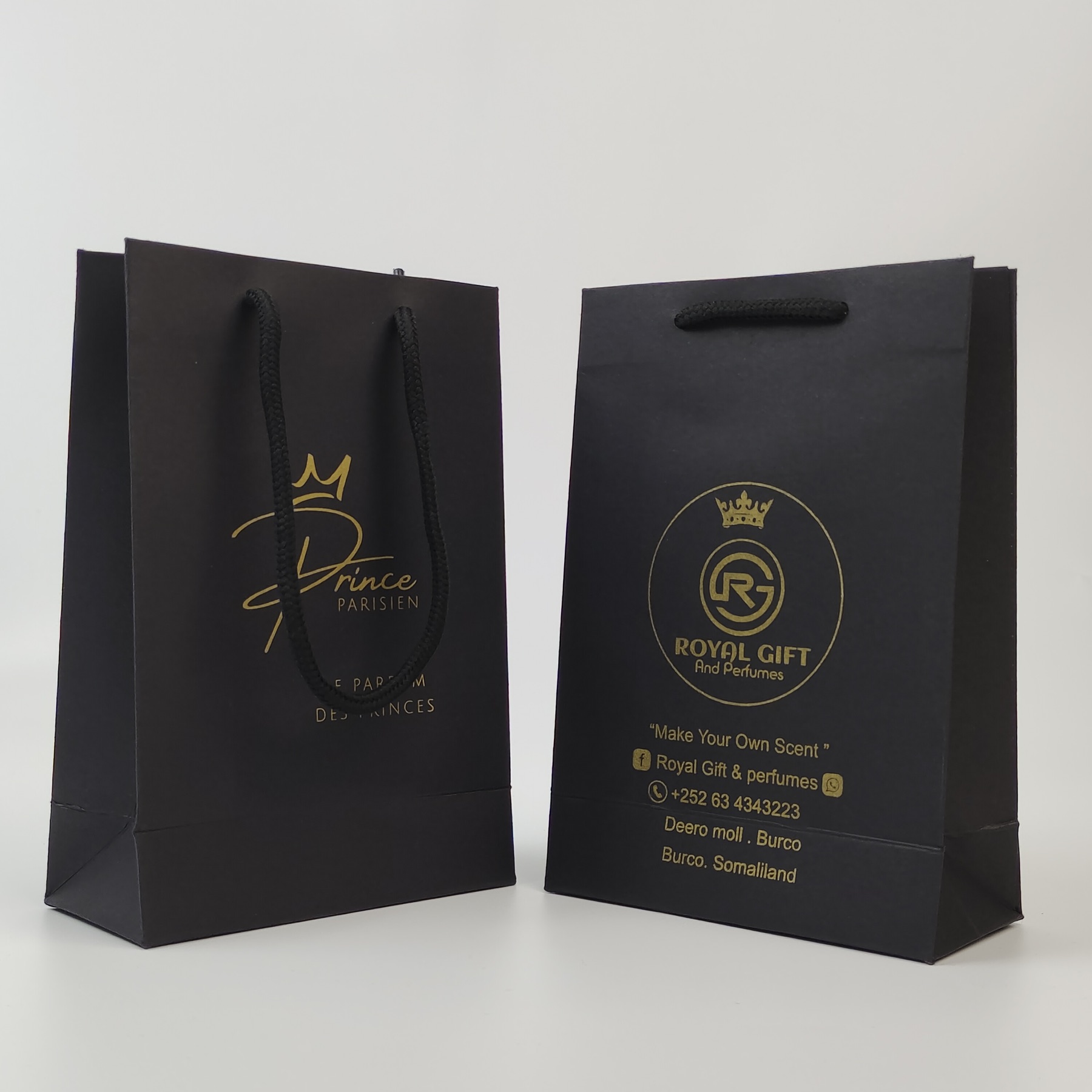 premium black paper shopping bag with gold printed artwork - view 2