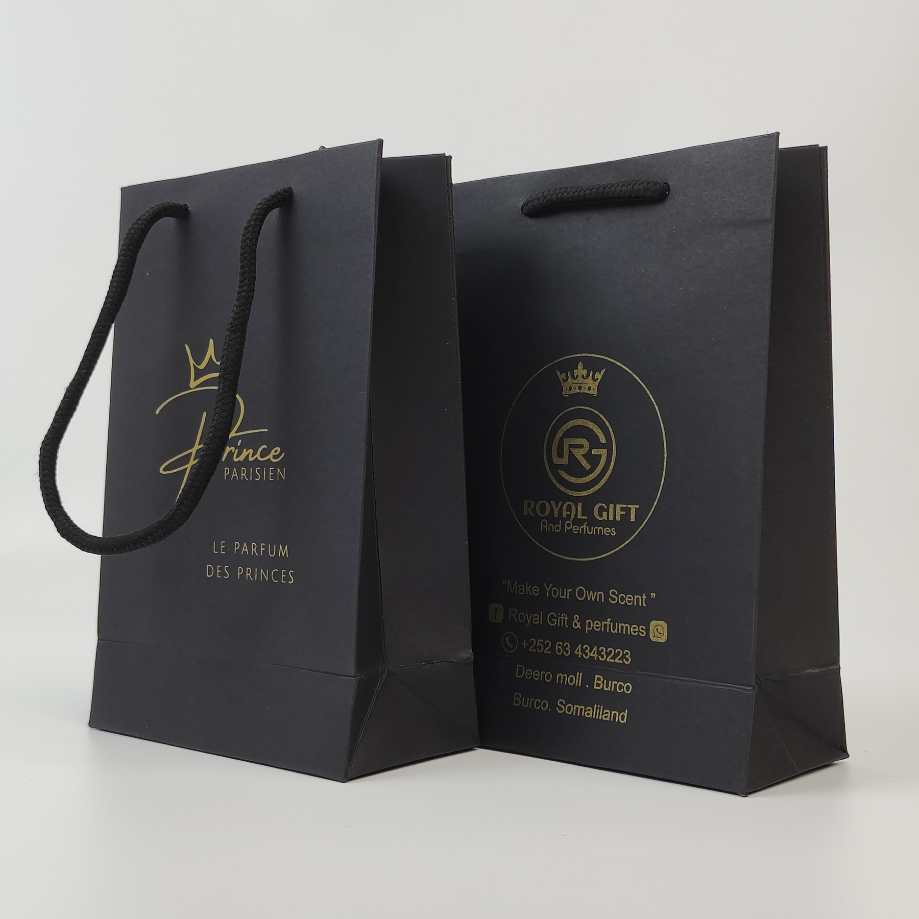 premium black paper shopping bag with gold printed artwork - view 3