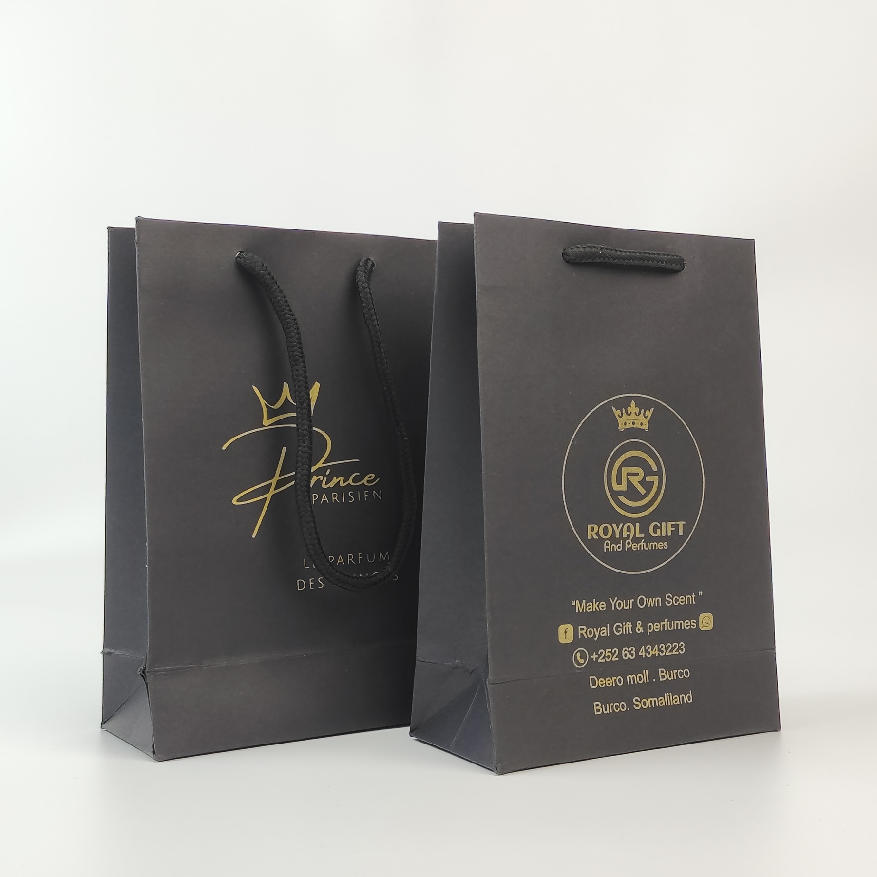 premium black paper shopping bag with gold printed artwork - view 4