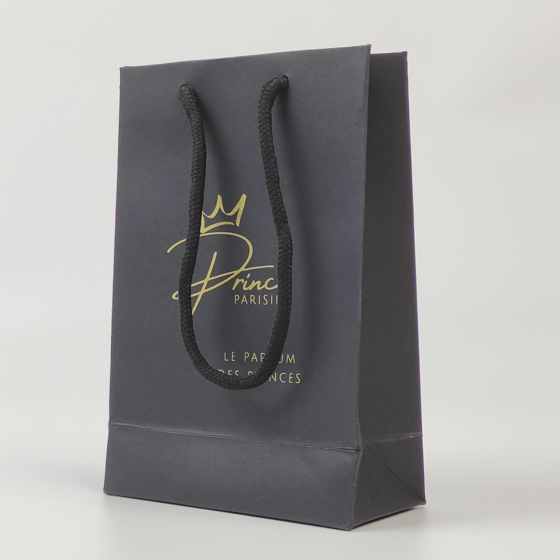 premium black paper shopping bag with gold printed artwork - view 5