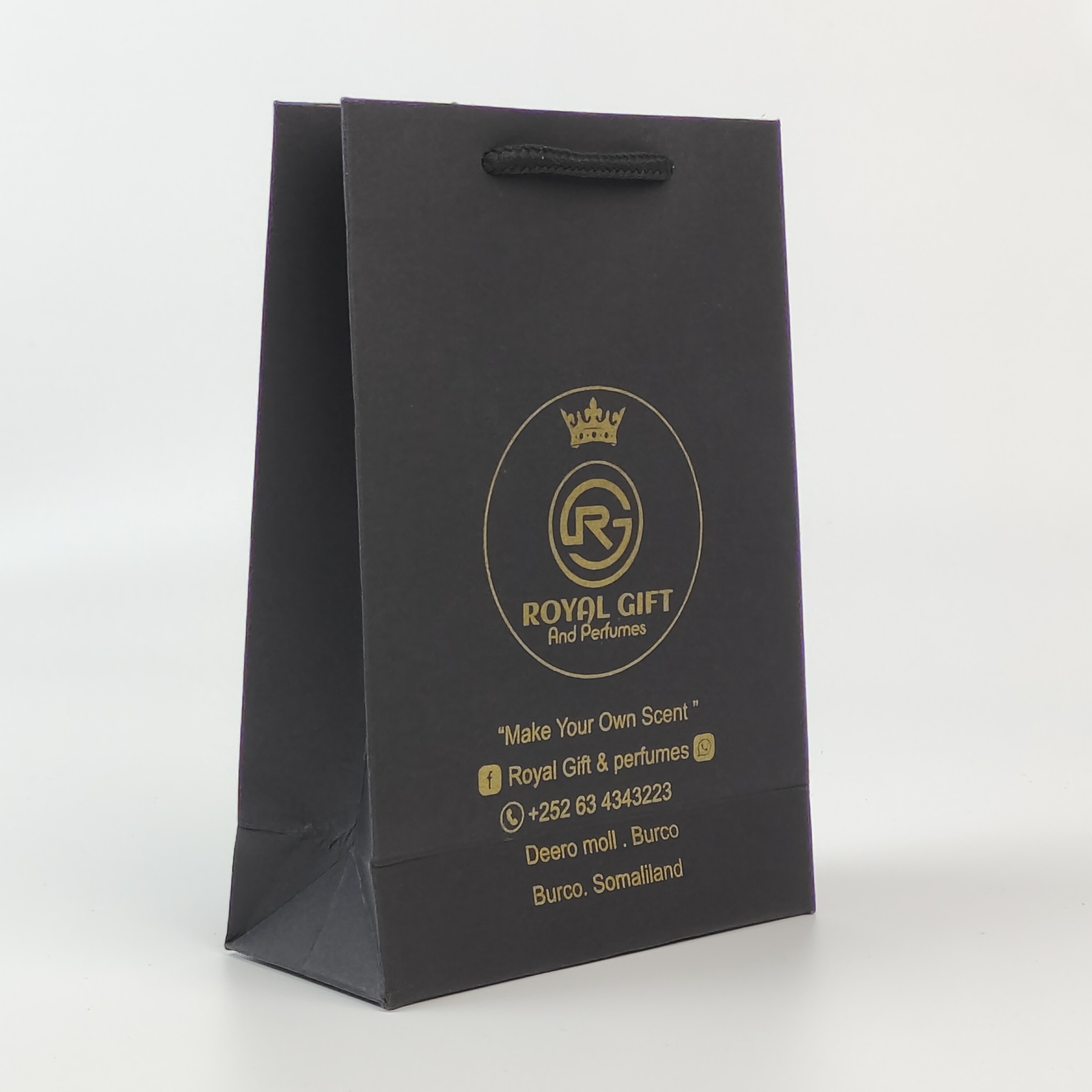 premium black paper shopping bag with gold printed artwork - view 6