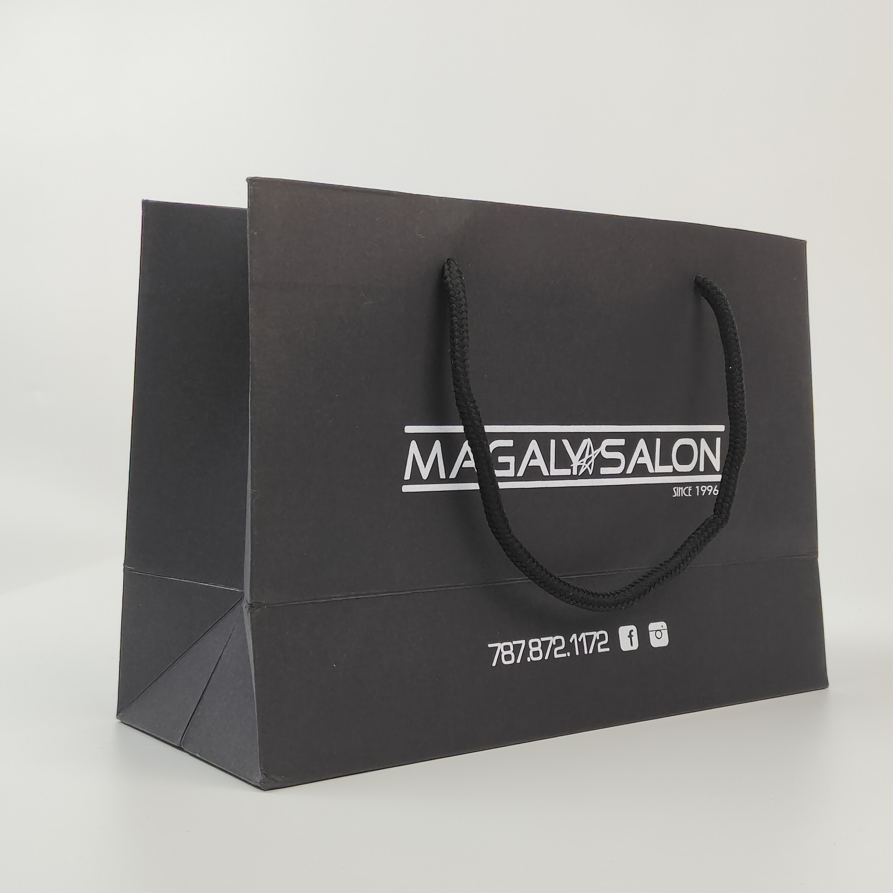 structured black paper shopping bag with silver printed decoration - view 6