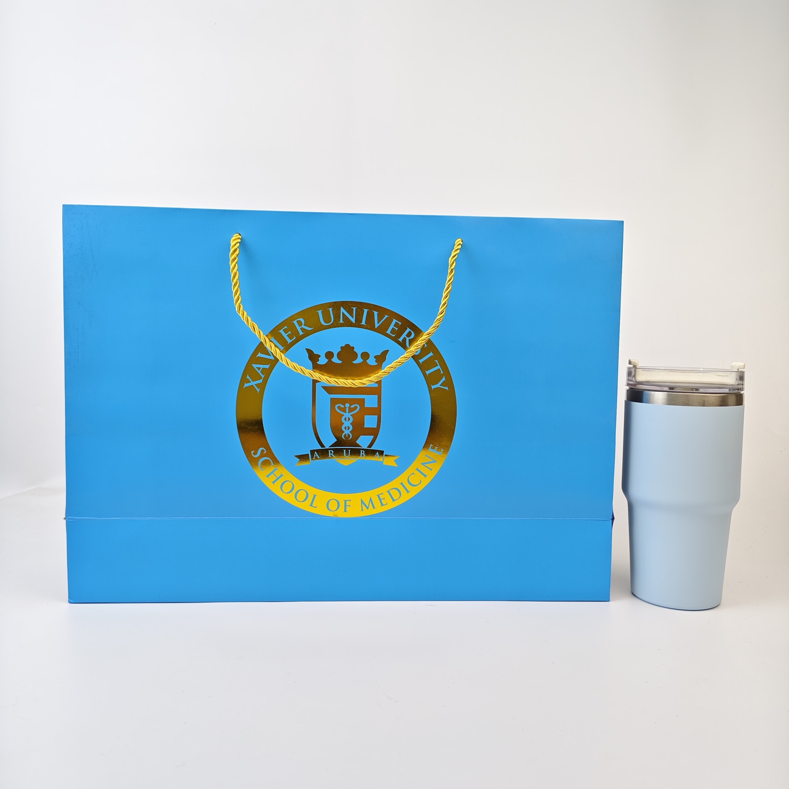 bright blue paper presentation bag with gold foil logo and rope handles - view 2