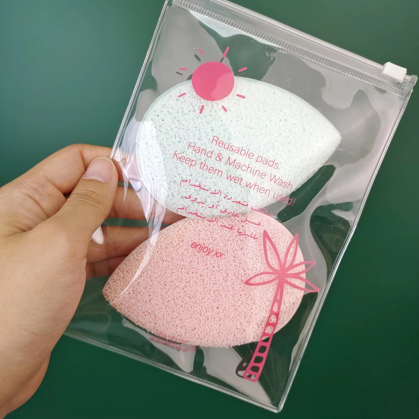 clear PVC slider pouch holding pink beauty sponges and accessories - view 2