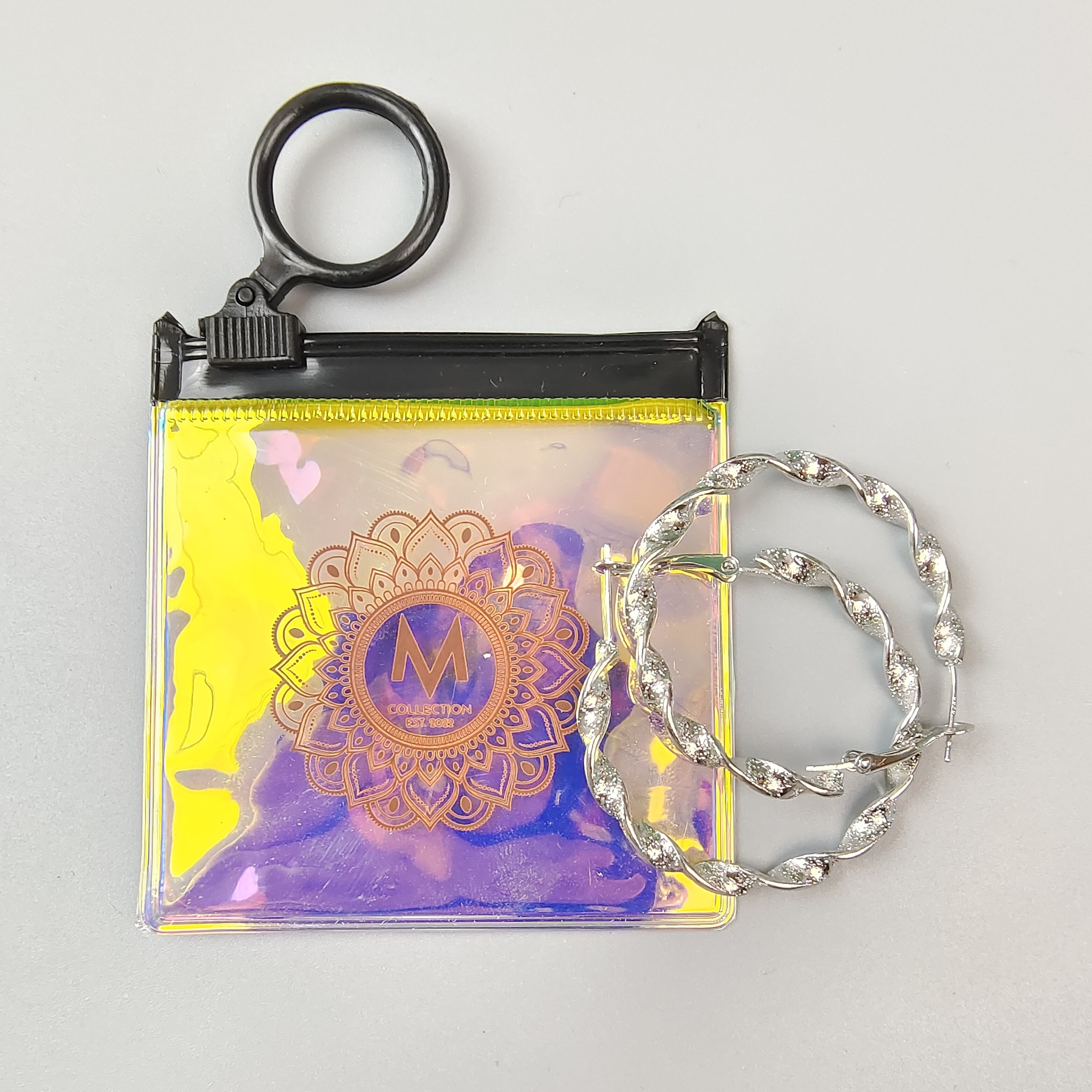 small holographic PVC jewelry pouch with circular black ring pull - view 3