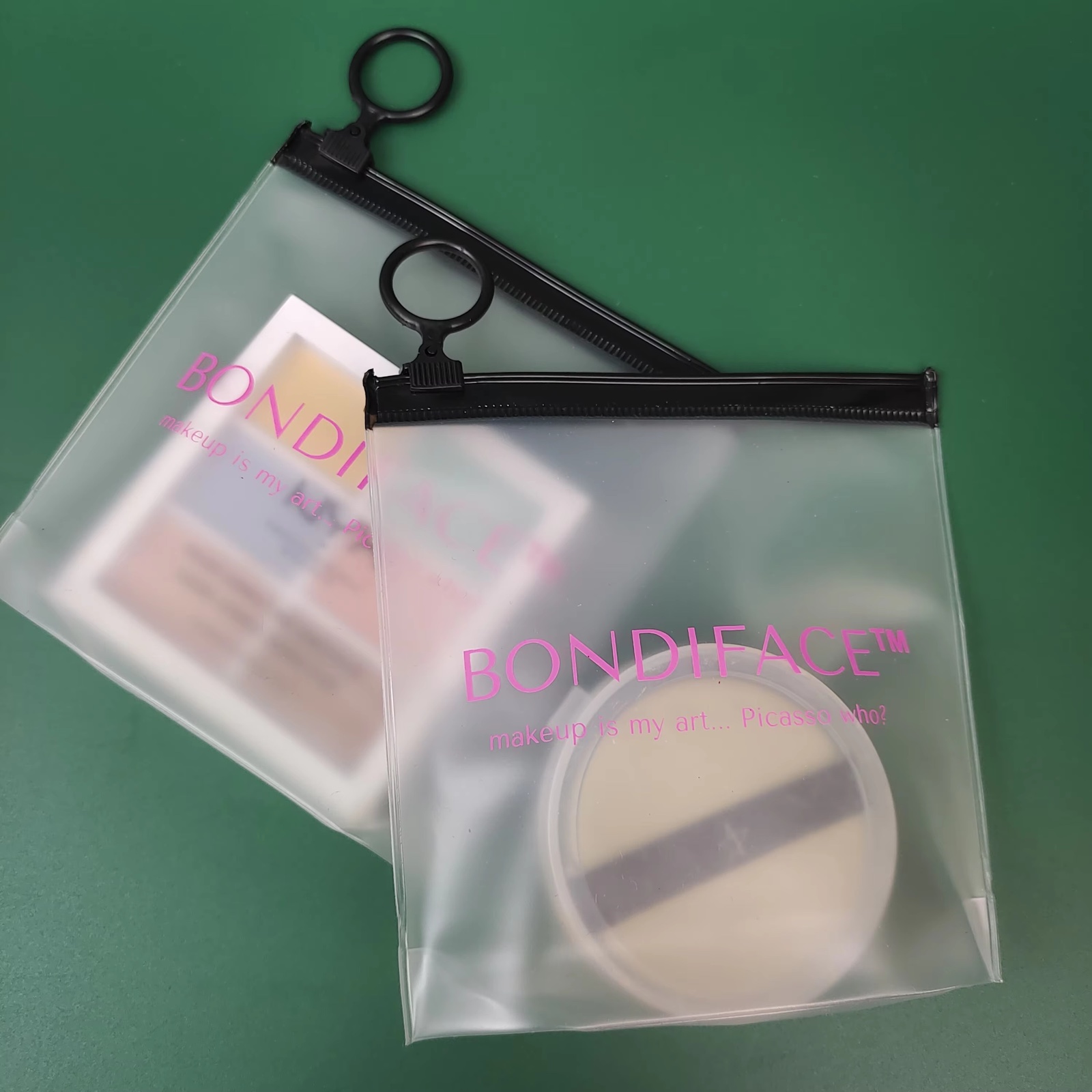 frosted PVC makeup pouches with pink logo and black ring pulls - view 2