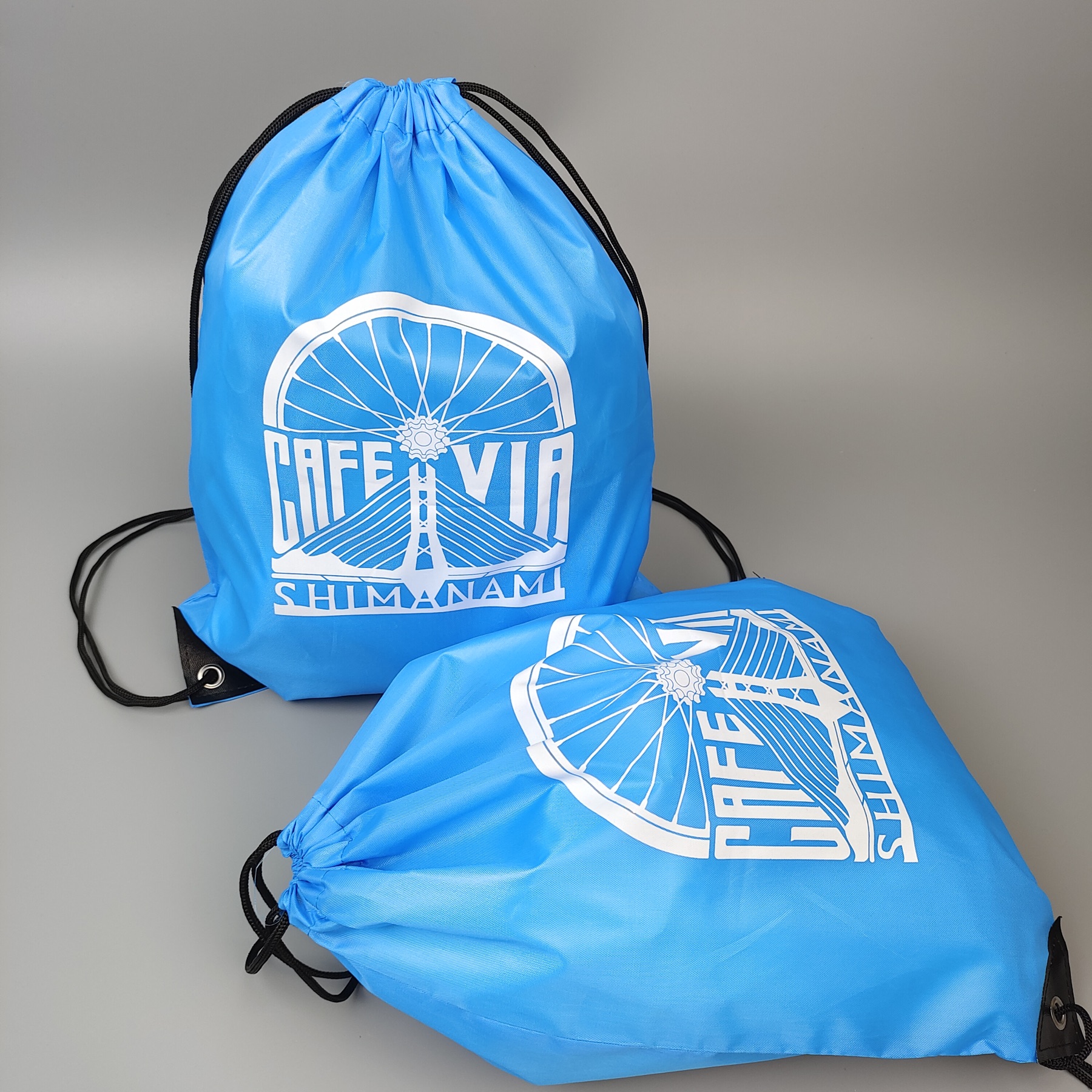 sky blue polyester drawstring backpack with screen printed artwork - view 2