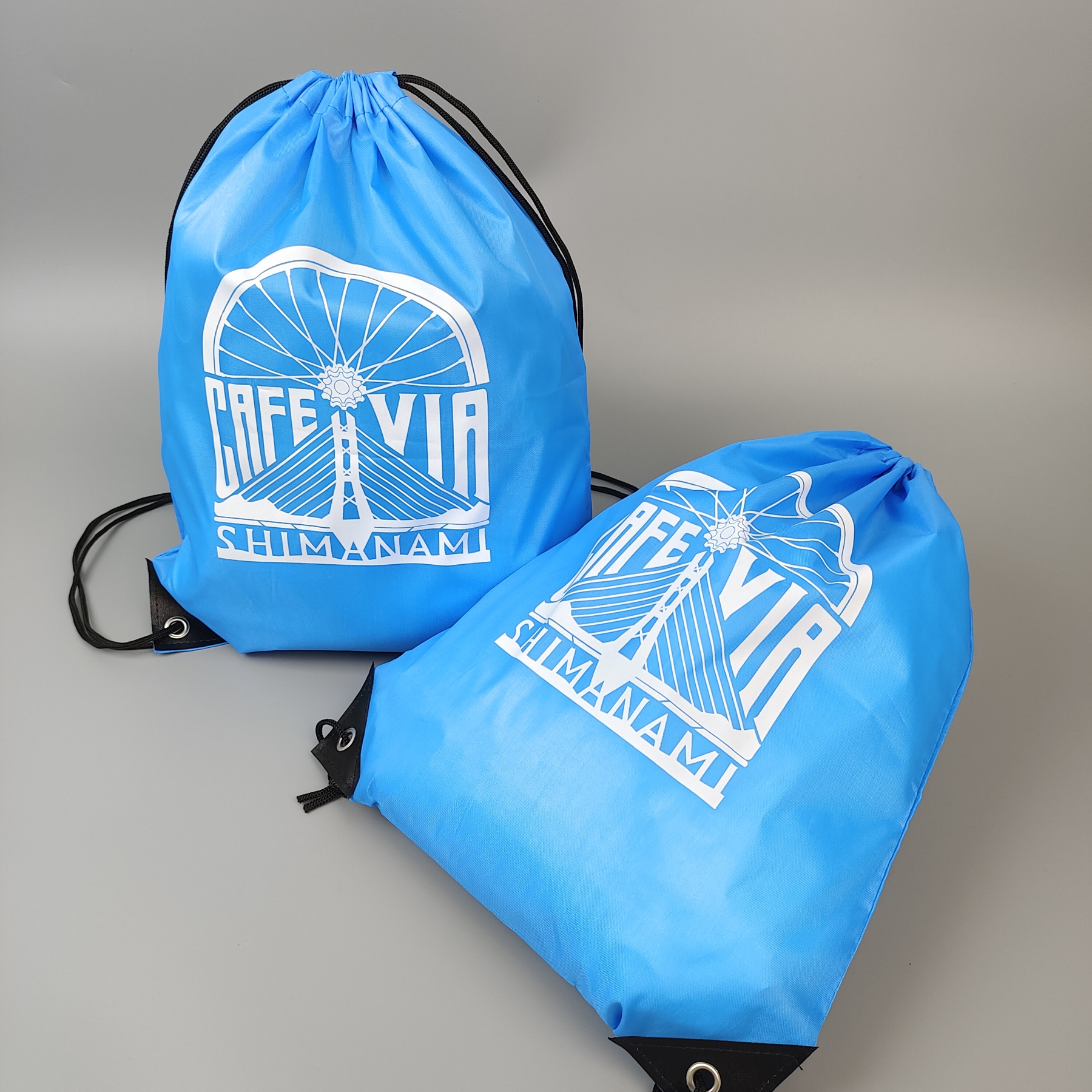 sky blue polyester drawstring backpack with screen printed artwork - view 3