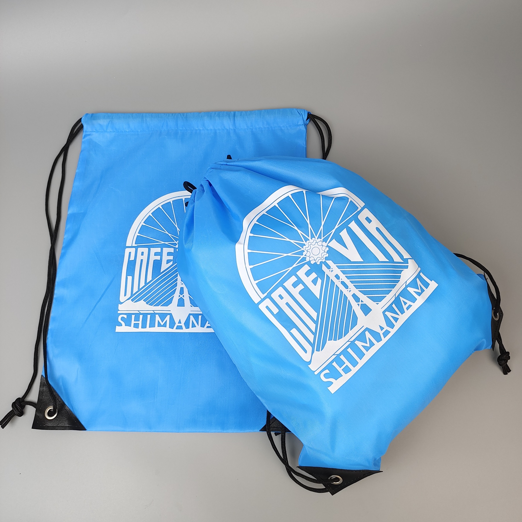 sky blue polyester drawstring backpack with screen printed artwork - view 5